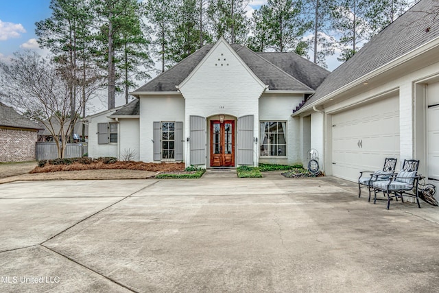 view of front of property featuring french doors and a garage