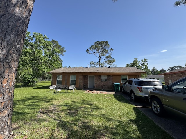 2730 E Angela Cir, Gulfport, MS 39503 - view of front facade featuring a front yard and brick siding