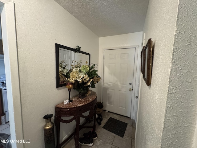 2730 E Angela Cir, Gulfport, MS 39503 - entryway with a textured ceiling and tile patterned floors