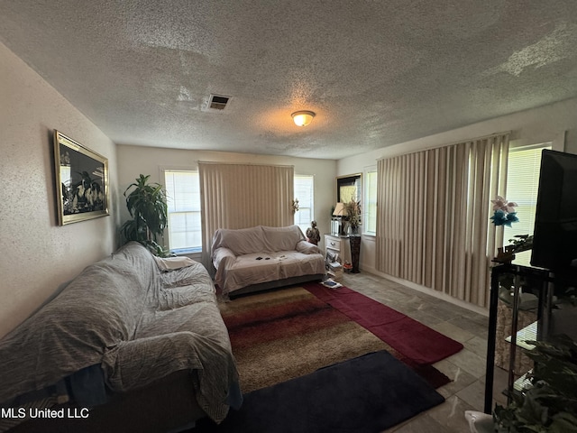 2730 E Angela Cir, Gulfport, MS 39503 - living area with plenty of natural light and a textured ceiling