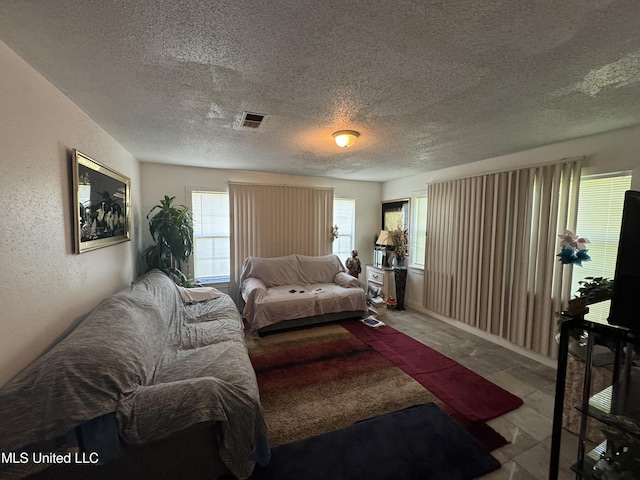 2730 E Angela Cir, Gulfport, MS 39503 - living room featuring a textured ceiling