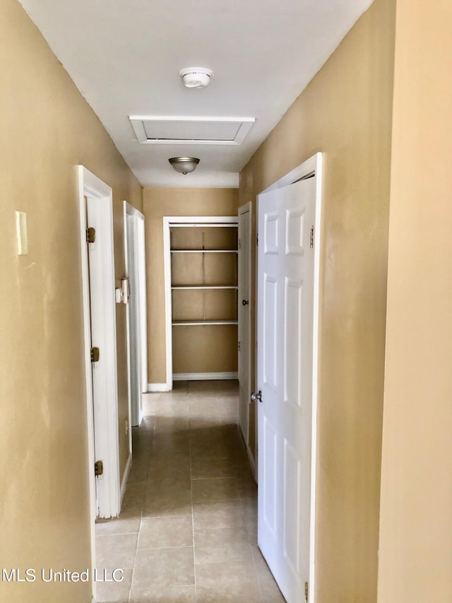 corridor featuring light tile patterned flooring