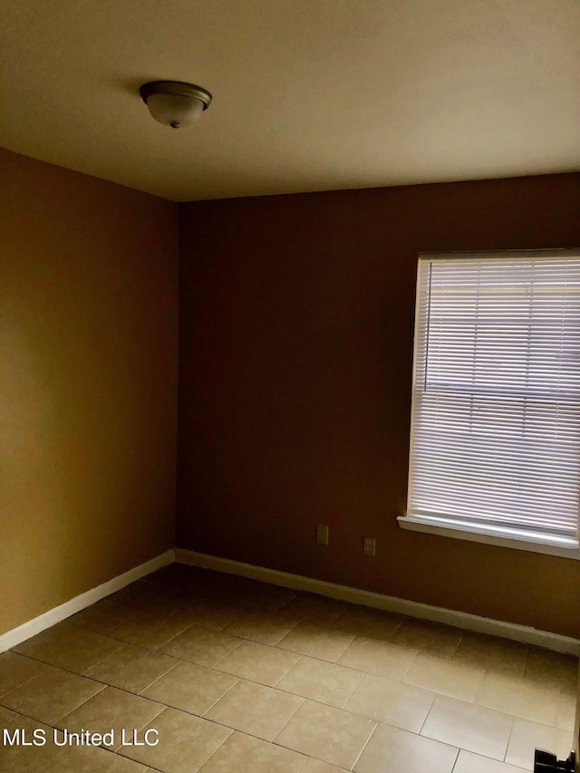 tiled empty room with plenty of natural light