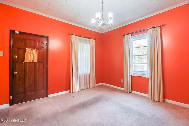 carpeted spare room with crown molding and a chandelier