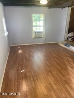 1431 Ranger Dr, Southaven, MS 38671 - empty room with baseboards, cooling unit, and wood finished floors