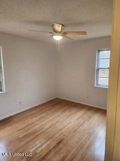 1431 Ranger Dr, Southaven, MS 38671 - empty room featuring wood finished floors, ceiling fan, and a textured ceiling