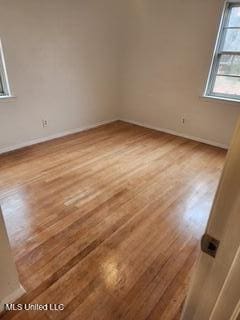 1431 Ranger Dr, Southaven, MS 38671 - empty room with wood finished floors and baseboards