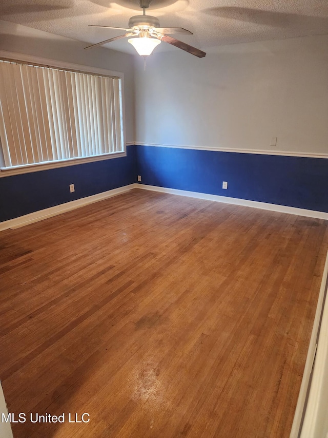 1431 Ranger Dr, Southaven, MS 38671 - unfurnished room featuring wood finished floors, a ceiling fan, baseboards, and a textured ceiling