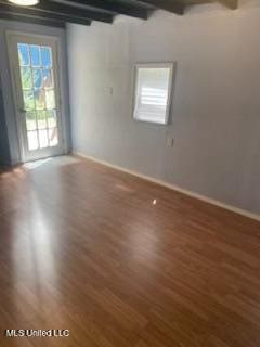 1431 Ranger Dr, Southaven, MS 38671 - empty room with baseboards, wood finished floors, and beamed ceiling