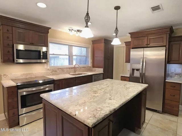 1704 Pat Dr, Gautier, MS 39553 - kitchen with light tile patterned flooring, a sink, a center island, stainless steel appliances, and visible vents