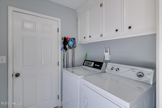 laundry area featuring cabinet space and washer and dryer