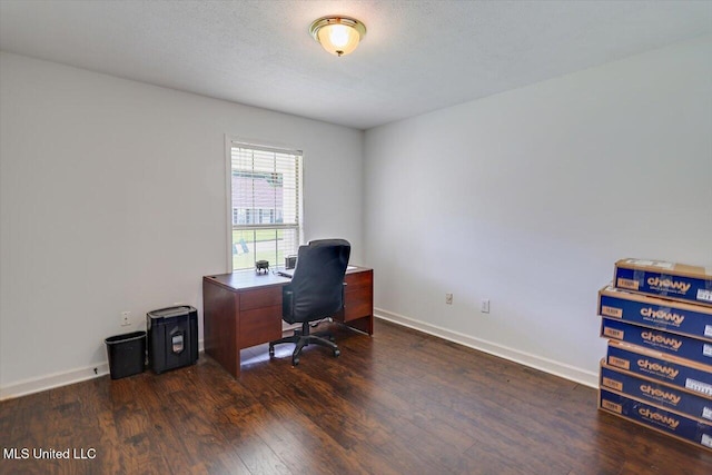 office featuring baseboards and dark wood finished floors