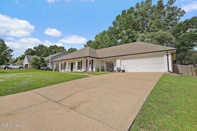 view of front of home featuring a front lawn, an attached garage, fence, concrete driveway, and a porch