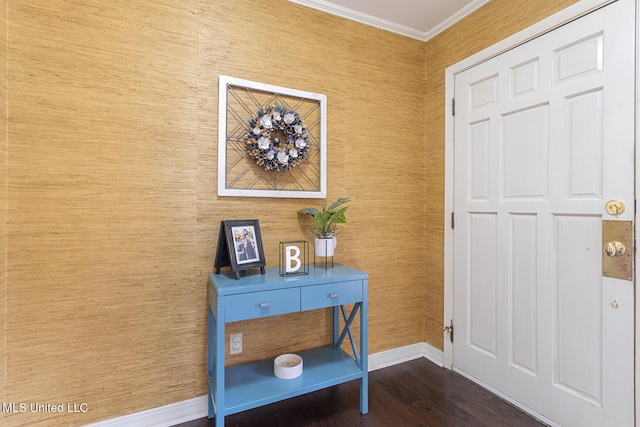 entrance foyer with crown molding, baseboards, and dark wood-style flooring