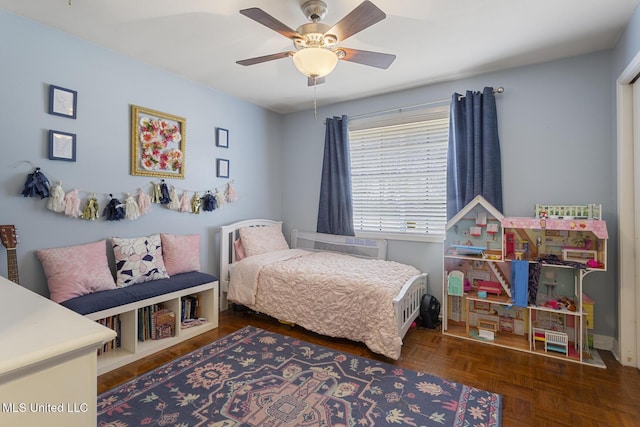 bedroom featuring baseboards and ceiling fan