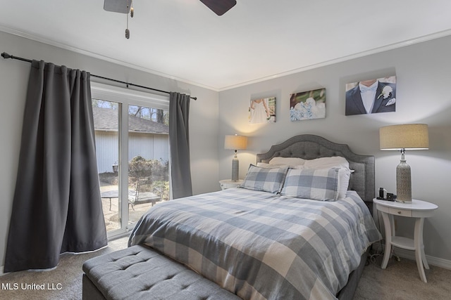 carpeted bedroom with ceiling fan, baseboards, and ornamental molding