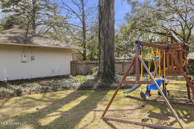 view of play area featuring a yard and fence