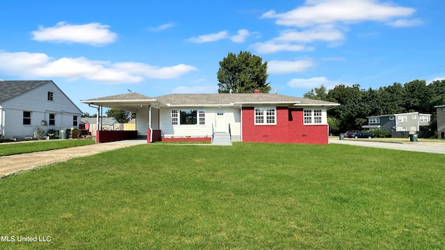 view of front of property with a front lawn and a carport