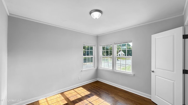 unfurnished room with dark wood-type flooring and ornamental molding