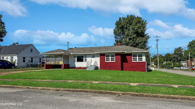 1049 Idlewild St, Memphis, TN 38107 - ranch-style home with a front lawn, an attached carport, and a chimney