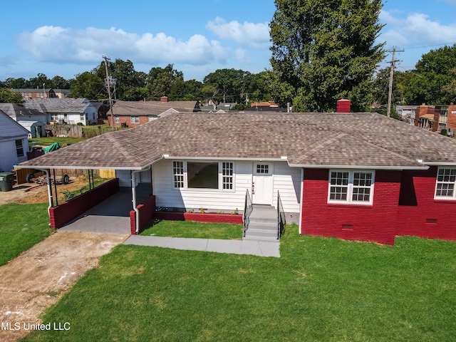 ranch-style home with a front lawn