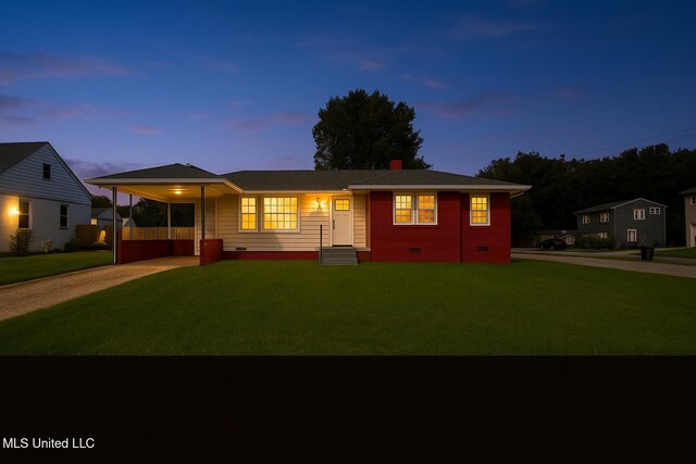 1049 Idlewild St, Memphis, TN 38107 - ranch-style home featuring crawl space, a front lawn, driveway, and an attached carport