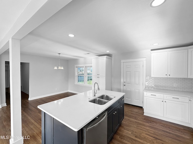 kitchen with dark hardwood / wood-style flooring, sink, an island with sink, stainless steel dishwasher, and white cabinetry