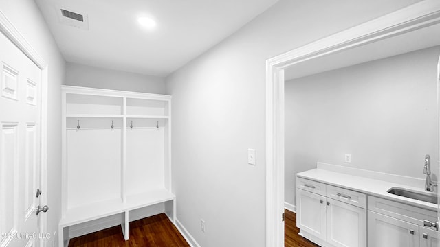 1049 Idlewild St, Memphis, TN 38107 - mudroom featuring a sink, dark wood-style floors, and baseboards