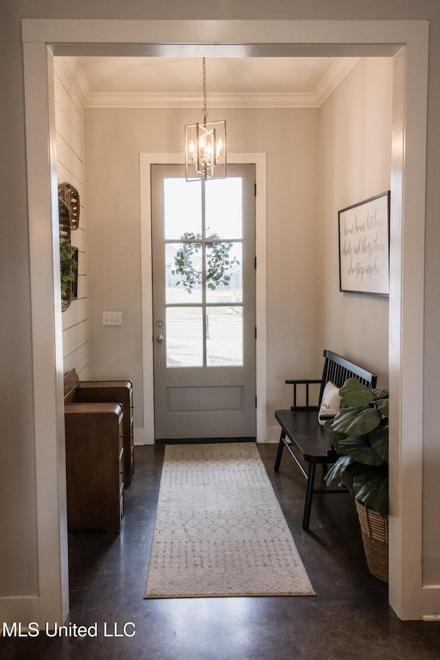 entryway featuring crown molding and a notable chandelier