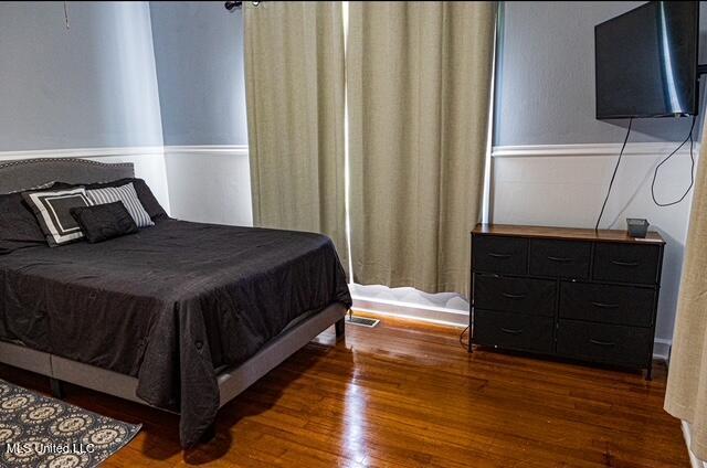 733 S College St, Grenada, MS 38901 - bedroom with wood finished floors