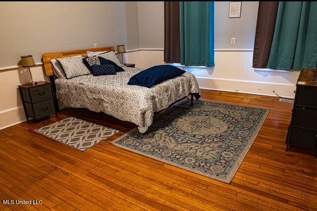 733 S College St, Grenada, MS 38901 - bedroom featuring hardwood / wood-style flooring and baseboards