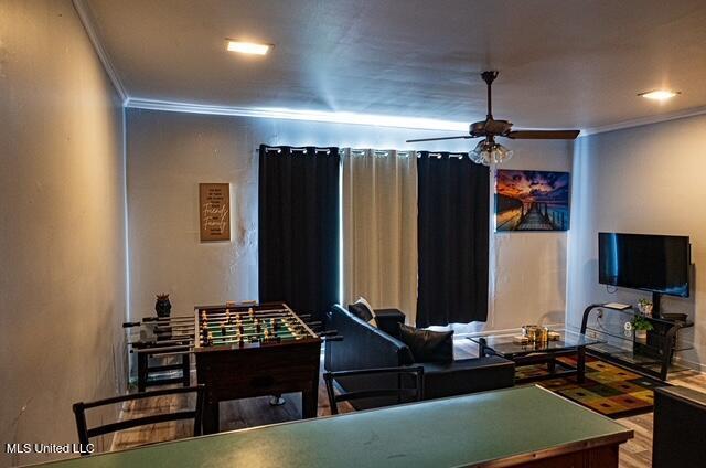 733 S College St, Grenada, MS 38901 - playroom with ornamental molding, ceiling fan, and wood finished floors