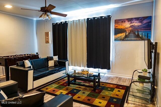 733 S College St, Grenada, MS 38901 - interior space featuring a ceiling fan, ornamental molding, and wood finished floors