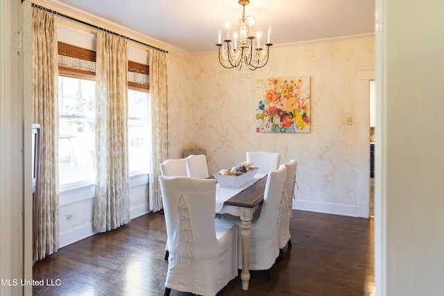 dining area with a notable chandelier, dark hardwood / wood-style floors, and ornamental molding