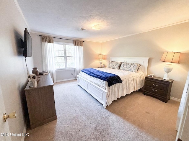 bedroom with light colored carpet, a textured ceiling, and ornamental molding