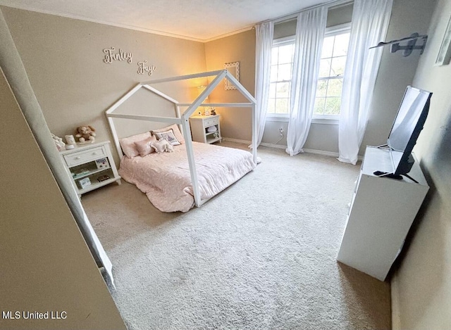 bedroom with a textured ceiling, carpet floors, and crown molding