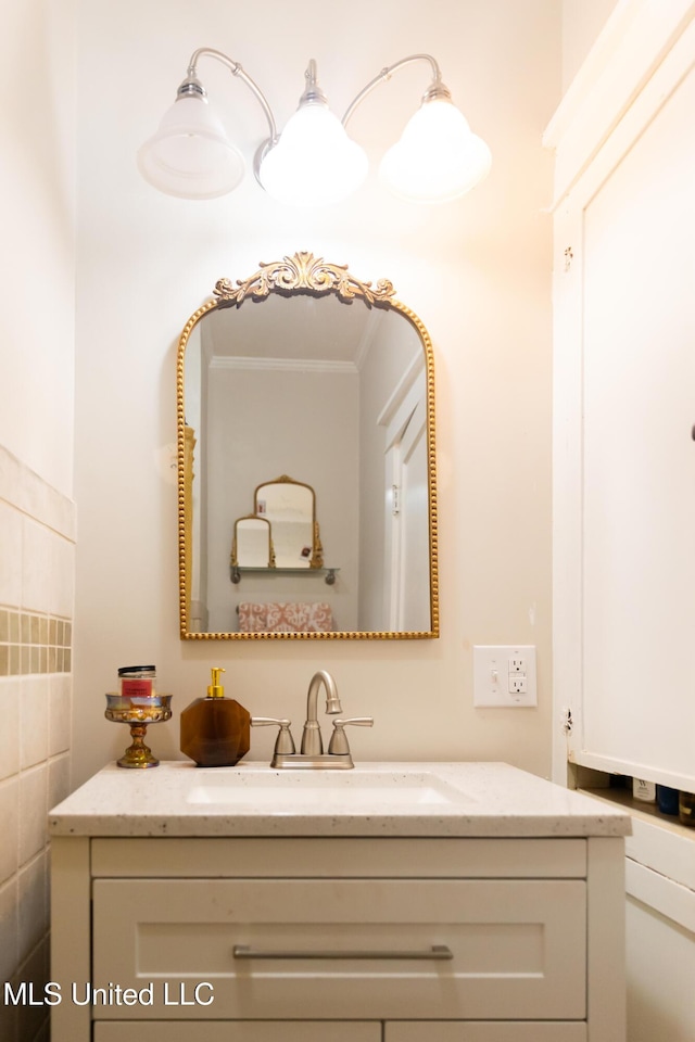 bathroom with vanity and tile walls