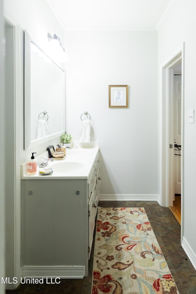 bathroom with crown molding, hardwood / wood-style floors, and vanity