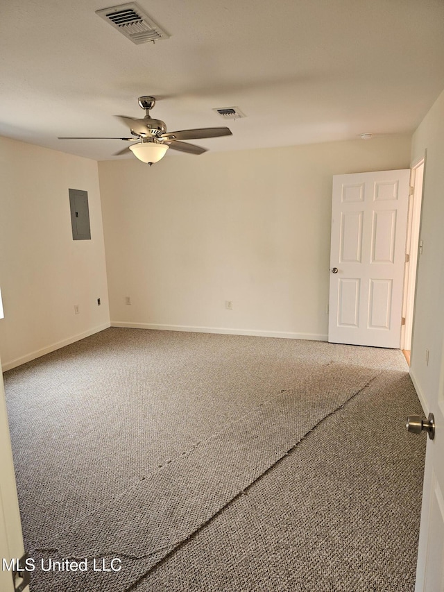 carpeted empty room with electric panel and ceiling fan