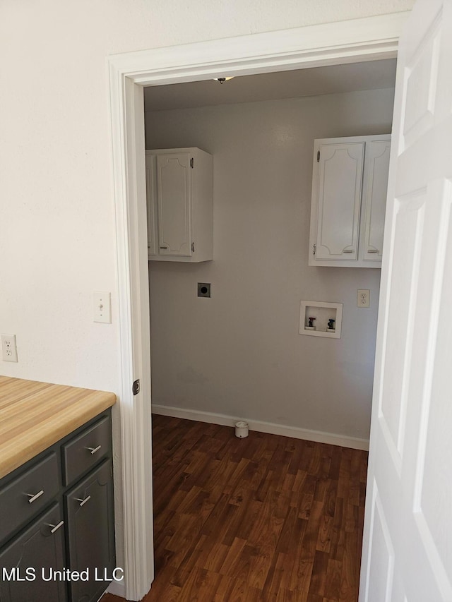 clothes washing area with hookup for a washing machine, dark hardwood / wood-style floors, cabinets, and hookup for an electric dryer