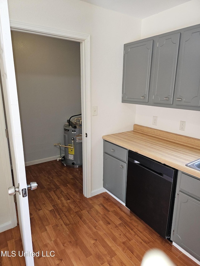 kitchen with sink, water heater, dishwasher, gray cabinetry, and dark hardwood / wood-style flooring