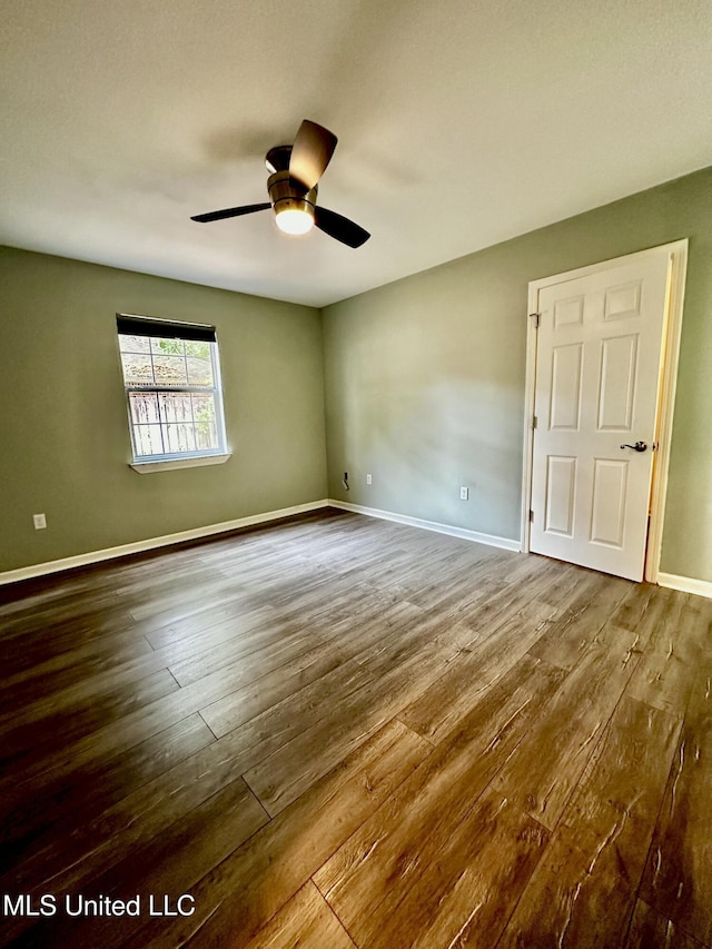 909 Orange St, Ocean Springs, MS 39564 - spare room featuring hardwood / wood-style floors, ceiling fan, and baseboards
