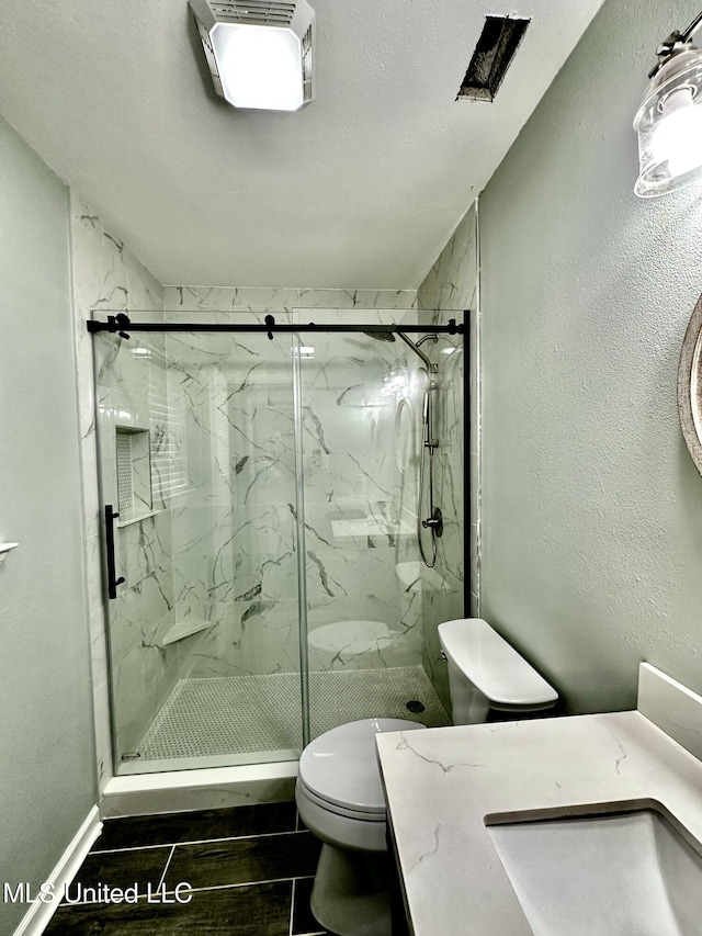 909 Orange St, Ocean Springs, MS 39564 - full bath with toilet, a marble finish shower, and vanity