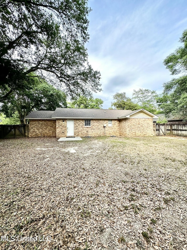 909 Orange St, Ocean Springs, MS 39564 - back of property with a fenced backyard