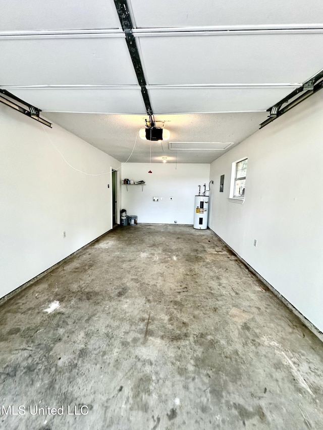 909 Orange St, Ocean Springs, MS 39564 - garage featuring electric water heater and a garage door opener