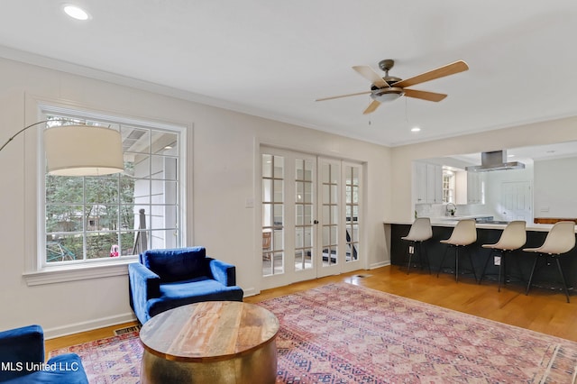 2123 Southwood Rd, Jackson, MS 39211 - living area featuring wood finished floors, a ceiling fan, baseboards, ornamental molding, and recessed lighting