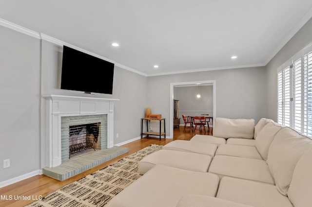 2123 Southwood Rd, Jackson, MS 39211 - living room with wood finished floors, recessed lighting, crown molding, baseboards, and a fireplace with raised hearth