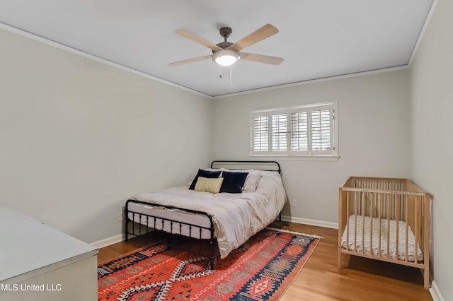 2123 Southwood Rd, Jackson, MS 39211 - bedroom featuring crown molding, wood finished floors, baseboards, and ceiling fan