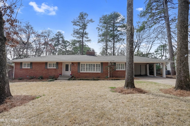 2123 Southwood Rd, Jackson, MS 39211 - ranch-style home with a chimney, concrete driveway, brick siding, a carport, and central AC unit