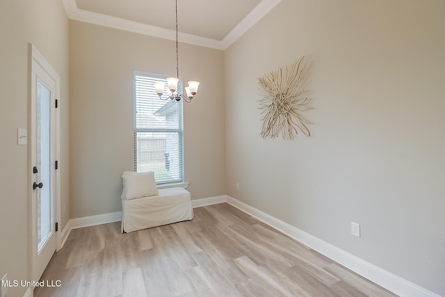 unfurnished room with light hardwood / wood-style flooring, a notable chandelier, a healthy amount of sunlight, and crown molding